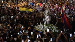 CARACAS, VENEZUELA - OCTOBER 18: People adore the statue of José Gregorio Hernández as part of the events in honor of the canonization of Blessed Jose Gregorio Hernandez and Blessed Carmen Rendiles MartÌnez on October 19, 2025 in Caracas, Venezuela. Mother Carmen and Jose Gregorio Hernandez Cisneros, a doctor, scientist, known as the Doctor of the Poor will be canonized by Pope Leo XIV during a solemn Mass at St. Peter's Basilica on October 19, 2025, and will be Venezuela's first two saints. (Photo by Jesus Vargas/Getty Images)