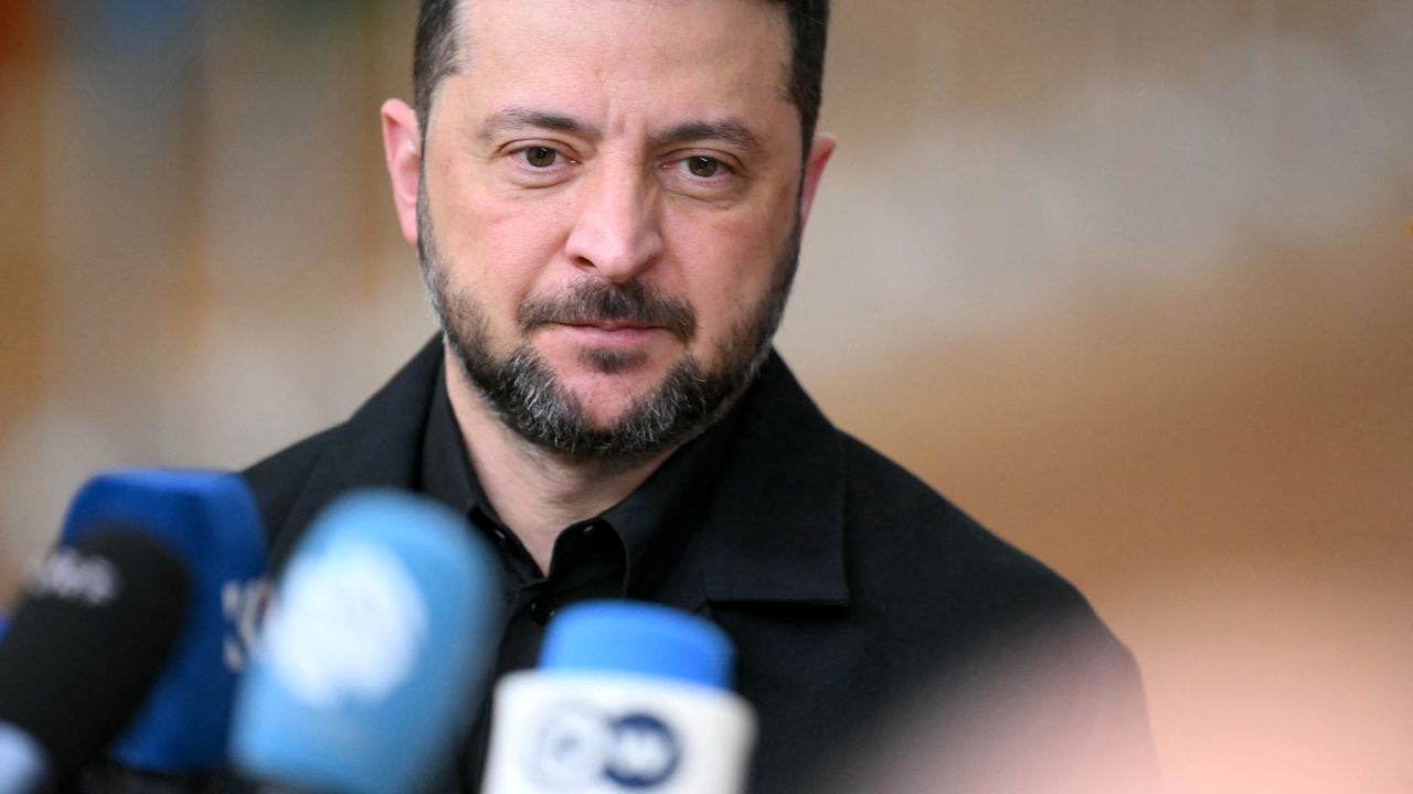 Ukraine's President Volodymyr Zelensky talks to the press as he arrives for a European Council meeting gathering the 27 EU leaders to discuss Ukraine, European defence, recent developments in the Middle East, competitiveness, housing and migration, in Brussels on October 23, 2025.