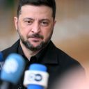 Ukraine's President Volodymyr Zelensky talks to the press as he arrives for a European Council meeting gathering the 27 EU leaders to discuss Ukraine, European defence, recent developments in the Middle East, competitiveness, housing and migration, in Brussels on October 23, 2025.