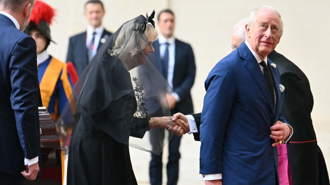 Britain's King Charles III and Britain's Queen Camilla arrive at San Damaso courtyard upon a meeting with Pope Leo XIV in the Vatican on October 23, 2025. (Photo by Alberto PIZZOLI / AFP) (Photo by ALBERTO PIZZOLI/AFP via Getty Images)