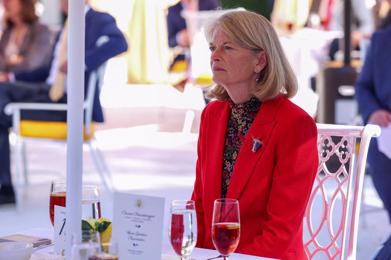 Sen. Lisa Murkowski listens as President Donald Trump delivers remarks during a luncheon in the Rose Garden of the White House on October 21.