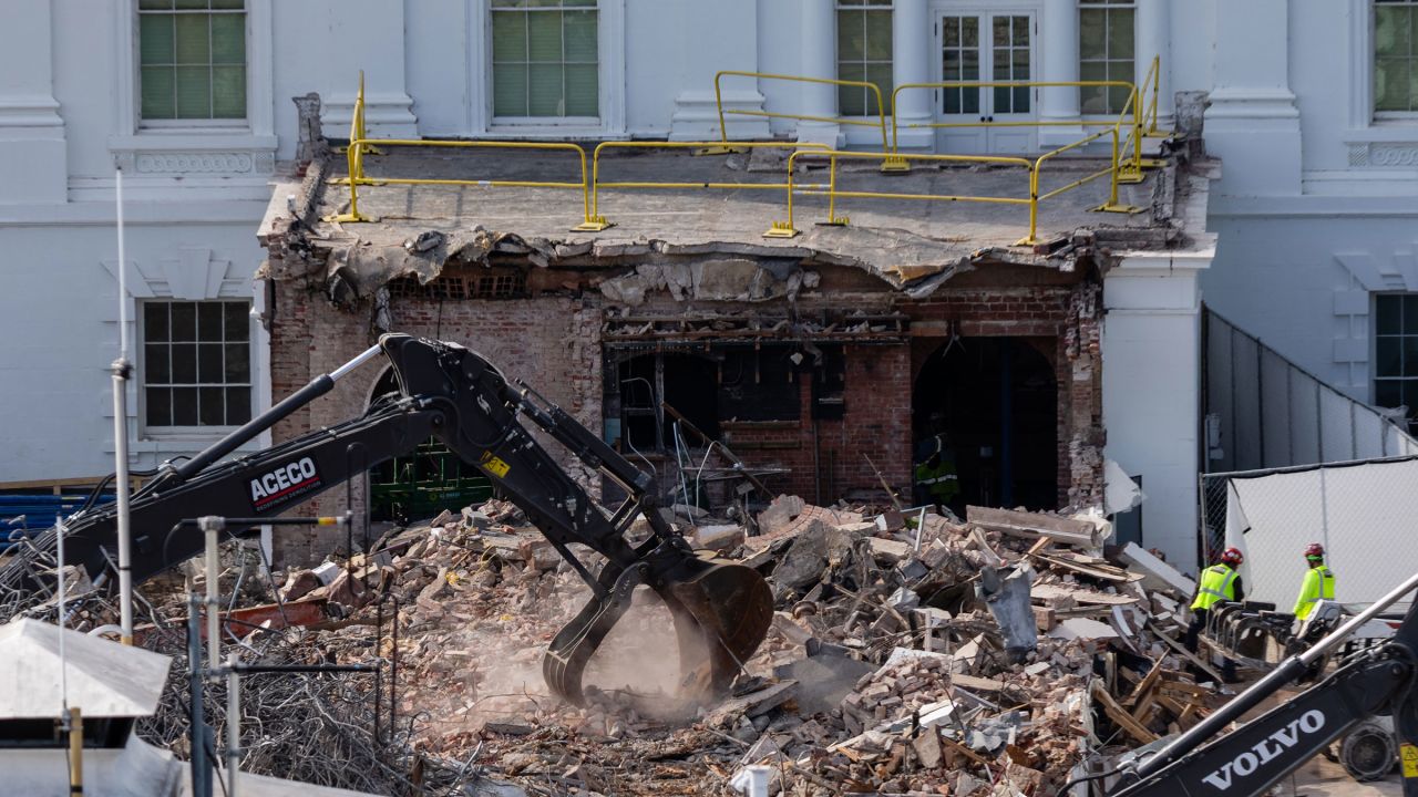 An excavator works to clear rubble after the East Wing of the White House was demolished, on Thursday.