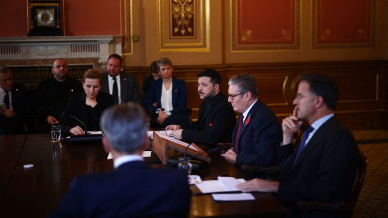 Britain's Prime Minister Keir Starmer (2R) sits with Ukraine's President Volodymyr Zelensky (3R), NATO Secretary-General Mark Rutte (R), Denmark's Prime Minister Mette Frederiksen (C top) and Netherlands Prime Minister Dick Schoof (C bottom) facing a screen with other participants joining by video link and senior aides including Britain's Foreign Secretary Yvette Cooper (4R) sat to the side as he hosts a 'Coalition of the Willing' meeting of international partners on Ukraine at the Foreign, Commonwealth, and Development Office (FCDO) in central London on October 24, 2025. British Prime Minister Keir Starmer told Ukraine's President Volodymyr Zelensky during a meeting in London on Friday that there was more that Western allies could do to bolster Kyiv's long-range missile capability. (Photo by HENRY NICHOLLS / POOL / AFP) (Photo by HENRY NICHOLLS/POOL/AFP via Getty Images)