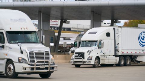Commercial trucks cross into Canada from the US at the Blue Water Bridge border crossing in Sarnia, Ontario, on October 24, 2025.