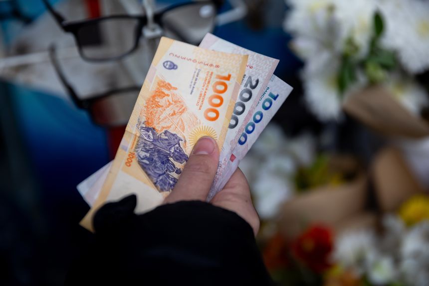 Argentine pesos at a store in Buenos Aires on October 27, 2025. Argentina's dollar bonds soared Monday after President Milei's party pulled off a surprisingly strong victory in Sunday's legislative elections, defying investor fears of a setback that would jeopardize his free-market overhauls and push the nation toward another economic crisis.