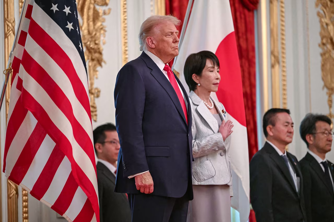 Japan's Prime Minister Sanae Takaichi , right, and US President Donald Trump review an honour guard of the Japan Self-Defense Force at the Akasaka State Guest House in Tokyo on Tuesday.