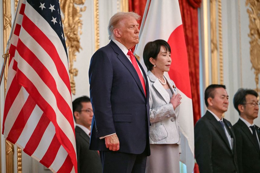 Japan's Prime Minister Sanae Takaichi and US President Donald Trump review an honor guard at the Akasaka State Guest House in Tokyo on October 28, 2025.