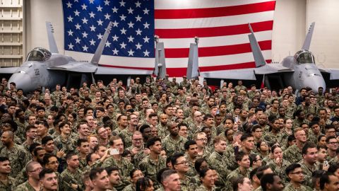 US Navy personnel look on during US President Donald Trump's visit to the USS George Washington aircraft carrier at the US naval base in Yokosuka on October 28, 2025. (Photo by Philip FONG / AFP) (Photo by PHILIP FONG/AFP via Getty Images)          