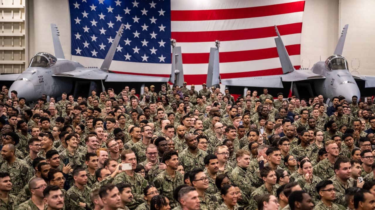 US Navy personnel look on during US President Donald Trump's visit to the USS George Washington aircraft carrier at the US naval base in Yokosuka on October 28, 2025. (Photo by Philip FONG / AFP) (Photo by PHILIP FONG/AFP via Getty Images)          