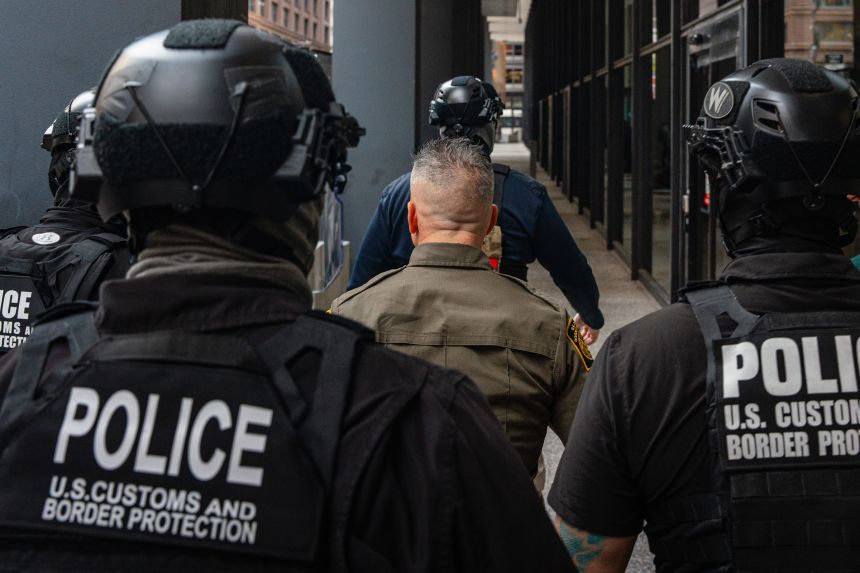 US Border Patrol commander Gregory Bovino enters the Dirksen Federal Building in Chicago on Tuesday.