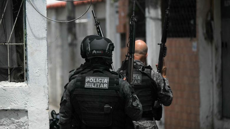 Militariy police officers patrol during "Operation Containment" in Rio de Janeiro's Complexo da Penha on October 28.