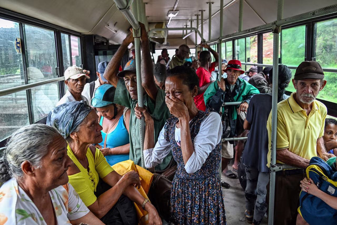 A woman reacts as she and other residents are evacuated from Playa Siboney in Santiago de Cuba, Cuba, on October 28.