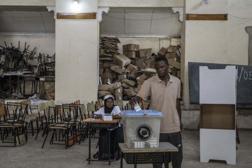 A man casts his ballot at a polling station in Stone Town on October 29.