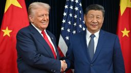US President Donald Trump and Chinese leader Xi Jinping shake hands at the start of talks at the Gimhae Air Base in Busan, South Korea.