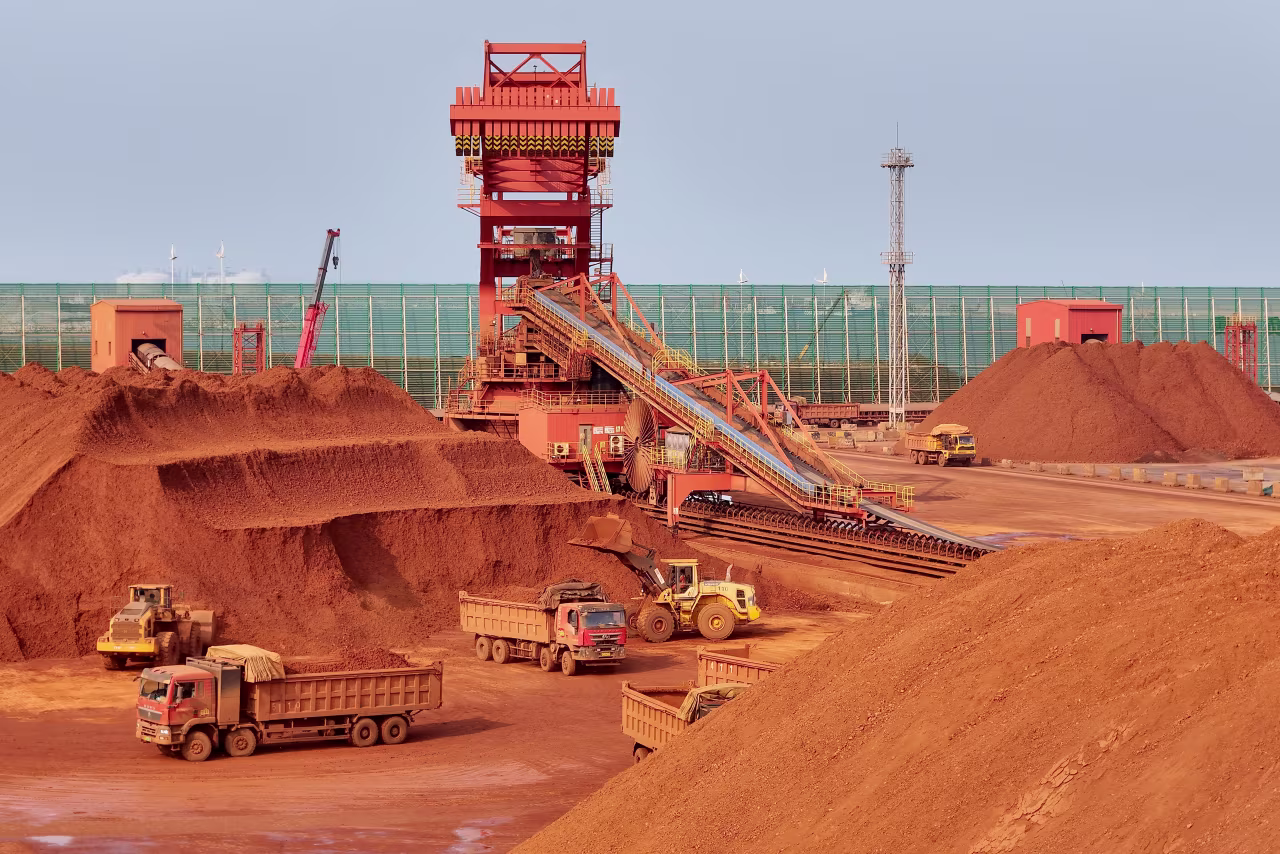 Heavy machinery handling bauxite ore is seen at the Yantai port in eastern China's Shandong province on Wednesday.