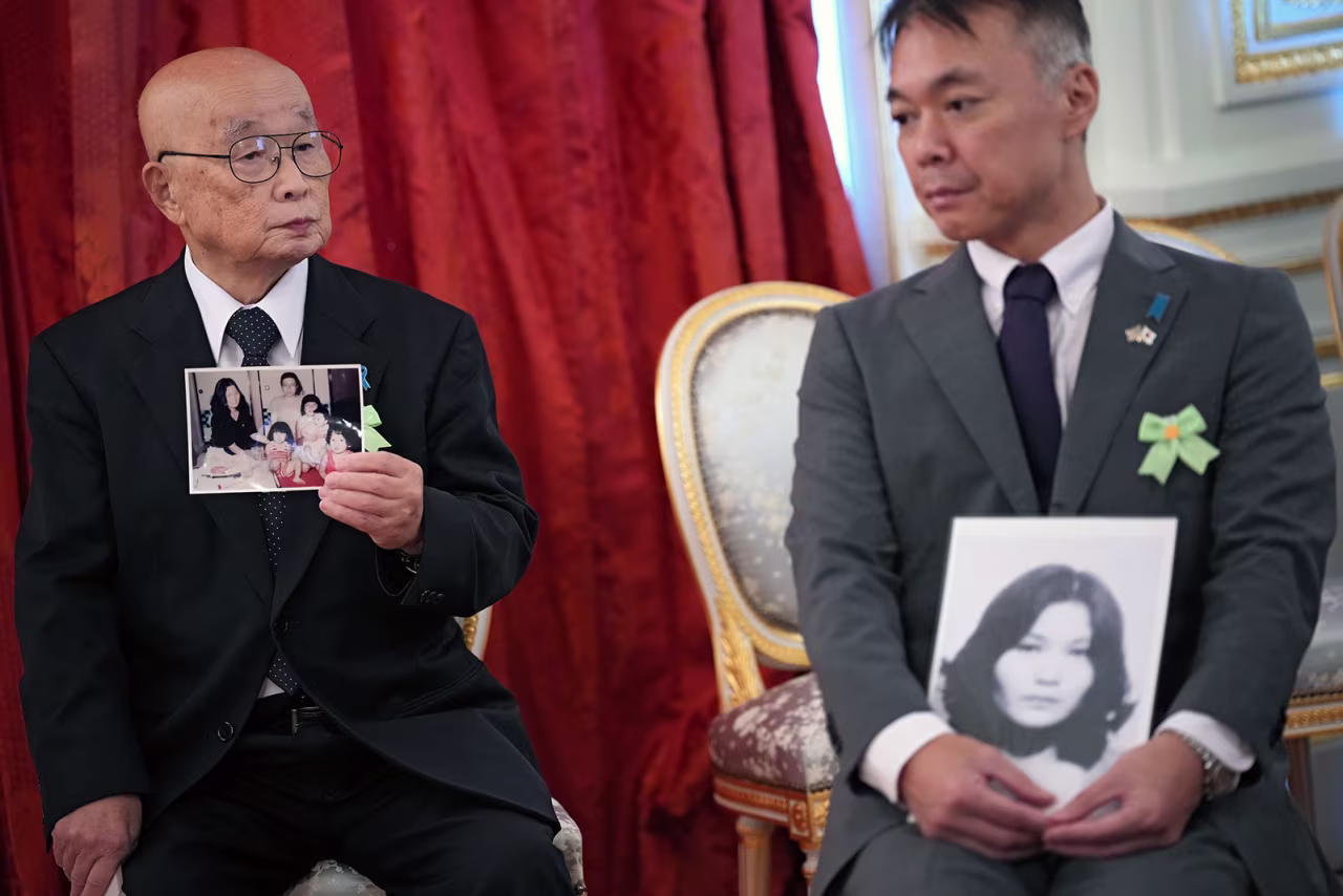 Family members of Japanese citizens abducted by North Korea hold pictures before meeting with US President Trump and Japanese Prime Minister Sanae Takaichi at Akasaka Palace in Tokyo, on Tuesday.