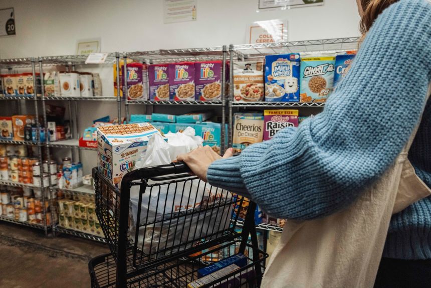 A resident browses donated food items in the pantry at Feeding South Florida in Pembroke Park, Florida, on October 31.