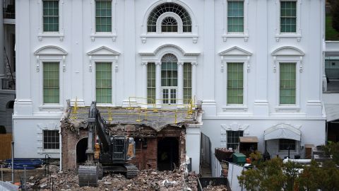 An excavator sits on the rubble after the East Wing of the White House was demolished, on Tuesday.