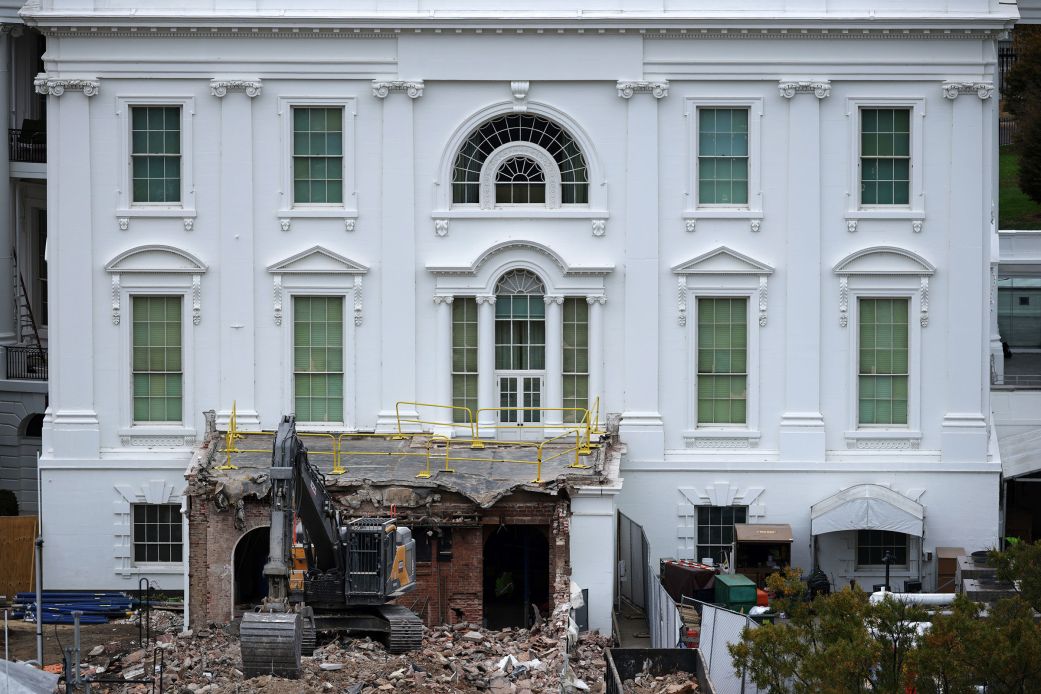 An excavator sits on the rubble after the East Wing of the White House was demolished, on Tuesday.