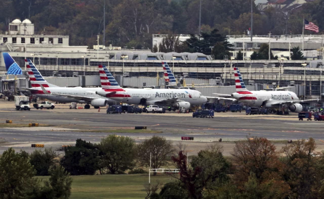 Aircrafts park at Ronald Reagan Washington National Airport on Tuesday, as seen from Washington, DC.