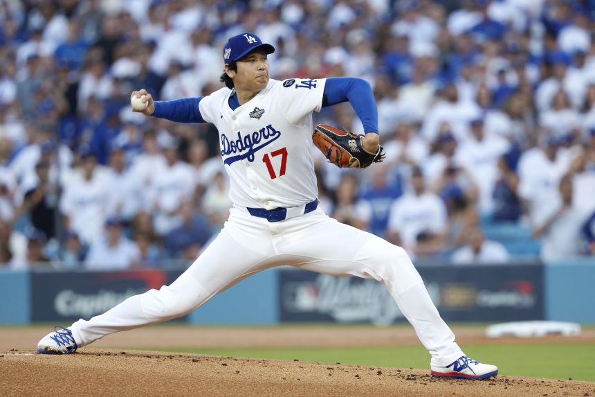 Dodgers superstar Shohei Ohtani throws a pitch in the first inning of Game 4. Will he start Game 7?