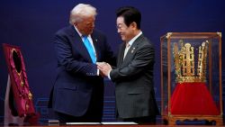 GYEONGJU, SOUTH KOREA - OCTOBER 29: U.S. President Donald Trump reacts as he is presented with the Grand Order of Mugunghwa and the Silla gold crown by South Korean President Lee Jae Myung at the Gyeongju National Museum on October 29, 2025 in Gyeongju, South Korea. Trump is in South Korea for the APEC meetings, following an appearance at the ASEAN summit in Malaysia, and a trip to Japan, where he called on Japanese Emperor Naruhito and new Prime Minister Sanae Takaichi. (Photo by Andrew Harnik/Getty Images)