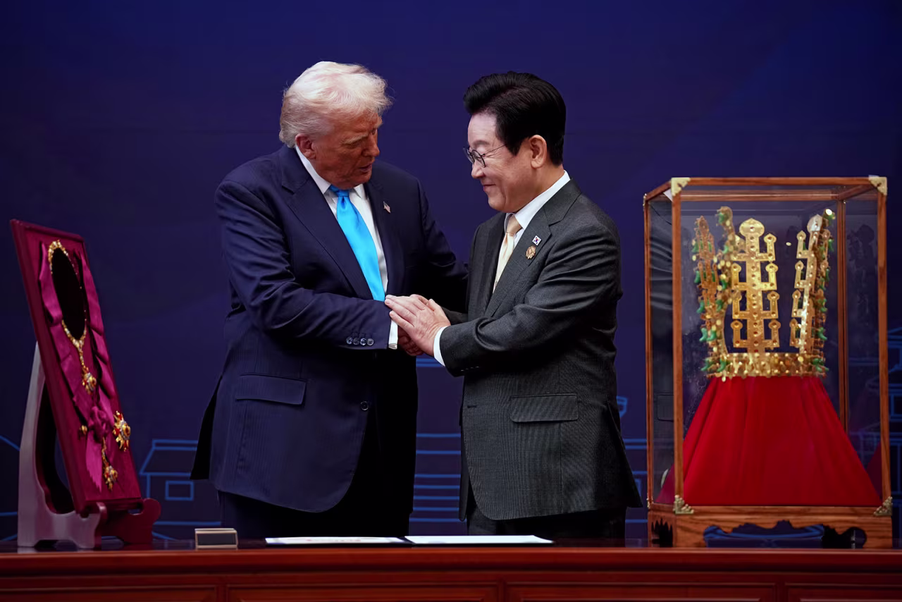 US President Donald Trump is presented with the Grand Order of Mugunghwa and the Silla gold crown by South Korean President Lee Jae Myung at the Gyeongju National Museum on Wednesday.
