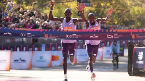Kenyans Benson Kipruto (L) and Alexander Mutiso celebrate taking first and second place respectively in New York.