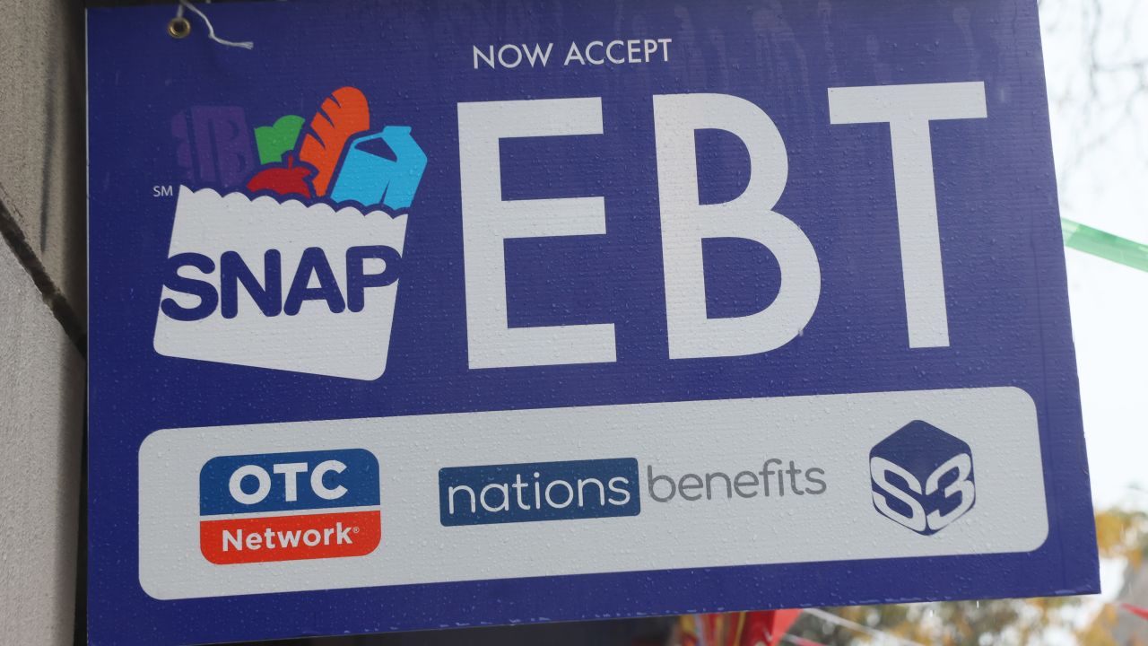 NEW YORK, NEW YORK - OCTOBER 30: An EBT sign is displayed on the window of a grocery store on October 30, 2025 in the Flatbush neighborhood of the Brooklyn borough in New York City.  Supplemental Nutrition Assistance Program (SNAP) benefits and other assistance are set to stop on November 1st amid a federal government shutdown that has been going on for 29 days and is the second-longest shutdown in the nation's history. New York Gov. Kathy Hochul declared a state of emergency for extra emergency funds and personnel to be deployed, as SNAP payments will be suspended. About 42 million Americans are expected to lose access to their benefits. (Photo by Michael M. Santiago/Getty Images)