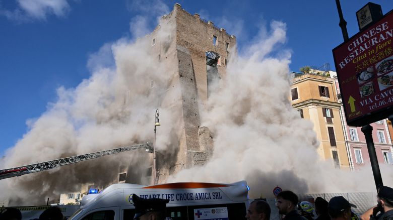 TOPSHOT - Dust rises due to a second collapse of part of the medieval tower "Torre dei Conti"  near the Roman Forum in the historic center of Rome on November 3, 2025. (Photo by Tiziana FABI / AFP) (Photo by TIZIANA FABI/AFP via Getty Images)          