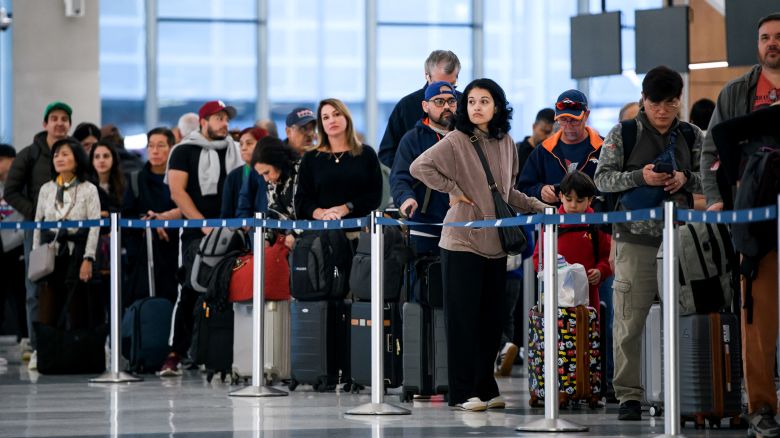 People wait in a security checkpoint line at George Bush Intercontinental Airport in Houston, Texas, on November 4, 2025. With the federal government shutdown entering its second month, lines at airports are expected to grow amid increased absenteeism among security and safety staff at some of the country's busiest hubs. (Photo by Mark Felix / AFP) (Photo by MARK FELIX/AFP via Getty Images)          