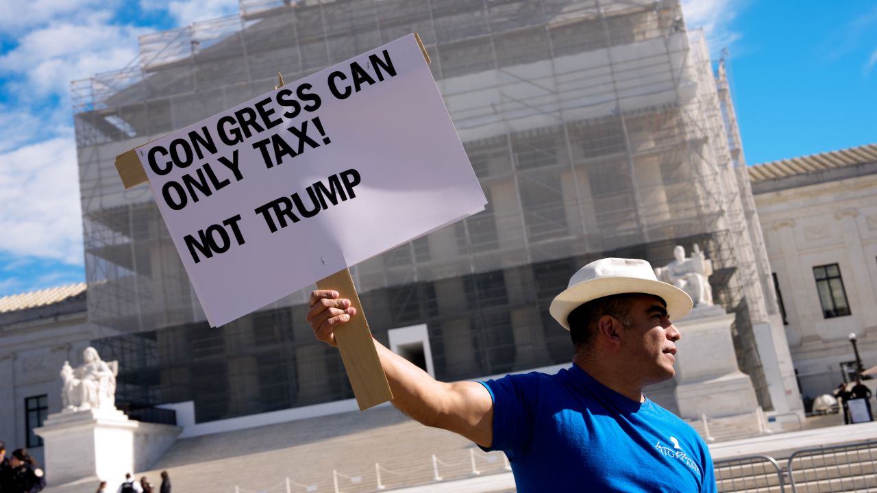 WASHINGTON, DC - NOVEMBER 5: An activist holds a sign that reads "Congress Can Only Tax! Not Trump" outside the Supreme Court on November 5, 2025 in Washington, DC. The high court is hearing arguments on the legality of the Trump Administration's tariffs. (Photo by Andrew Harnik/Getty Images)