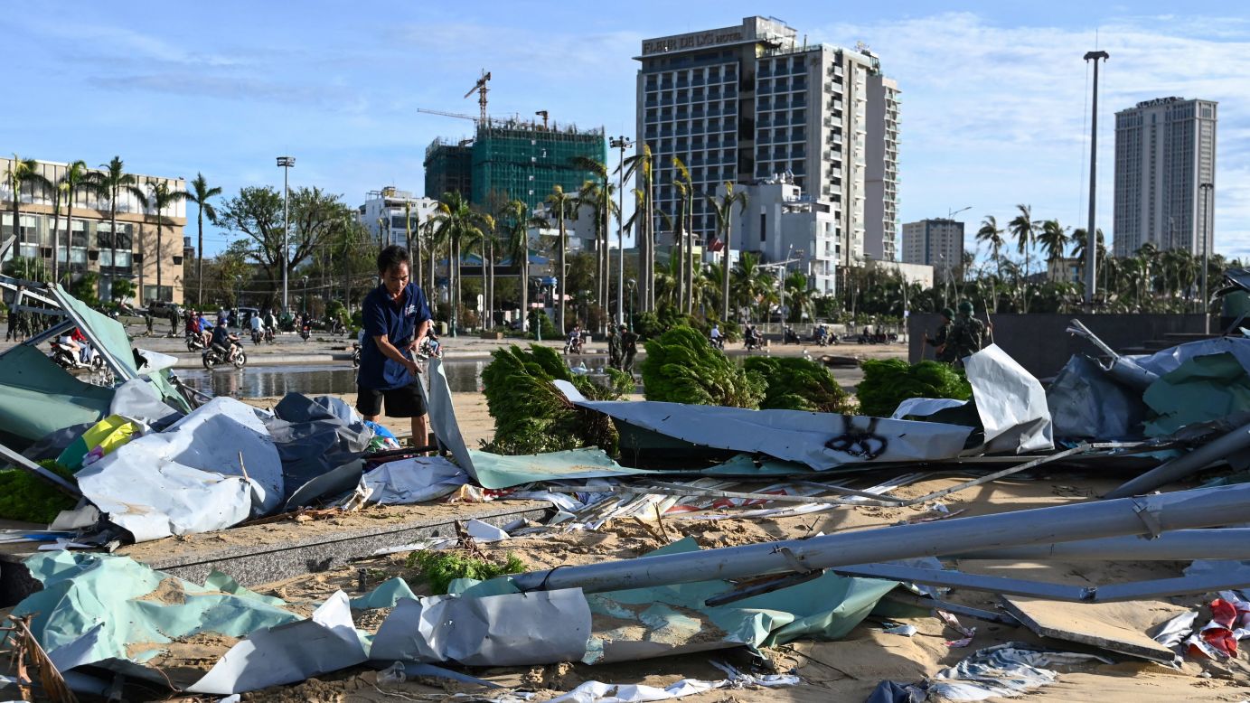 A man picks up debris in Quy Nhon in Gia Lai province, central Vietnam on November 7, 2025, after typhoon Kalmaegi hit the area.