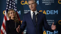 SACRAMENTO, CALIFORNIA - NOVEMBER 04: California Gov. Gavin Newsom (R) speaks as his wife Jennifer Siebel Newsom (L) looks on during an election night gathering at the California Democrats headquarters on November 04, 2025 in Sacramento, California. California voters approved Proposition 50, a measure that will replace the state’s current congressional district map with new, legislature-drawn lines from 2026 through 2030.  (Photo by Justin Sullivan/Getty Images)
