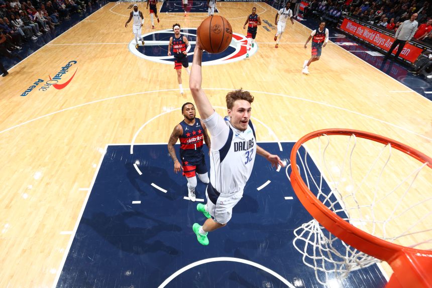 Mavericks rookie Cooper Flagg throws down a dunk during a game in Washington on Saturday.