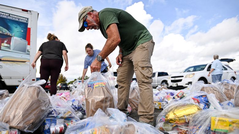 Volunteers organize bags of groceries during a free food distribution for recipients of the Supplemental Nutrition Assistance Program (SNAP) organized by the Volusia County Sheriff's Office and The Jewish Federation at the Daytona International Speedway in Daytona Beach, Florida, on November 9, 2025. The US Supreme Court said on November 7 that the Trump administration does not have to immediately pay SNAP food benefits defunded during the government shutdown, a temporary order that leaves millions in limbo. (Photo by Miguel J. Rodriguez Carrillo / AFP) (Photo by MIGUEL J. RODRIGUEZ CARRILLO/AFP via Getty Images)          