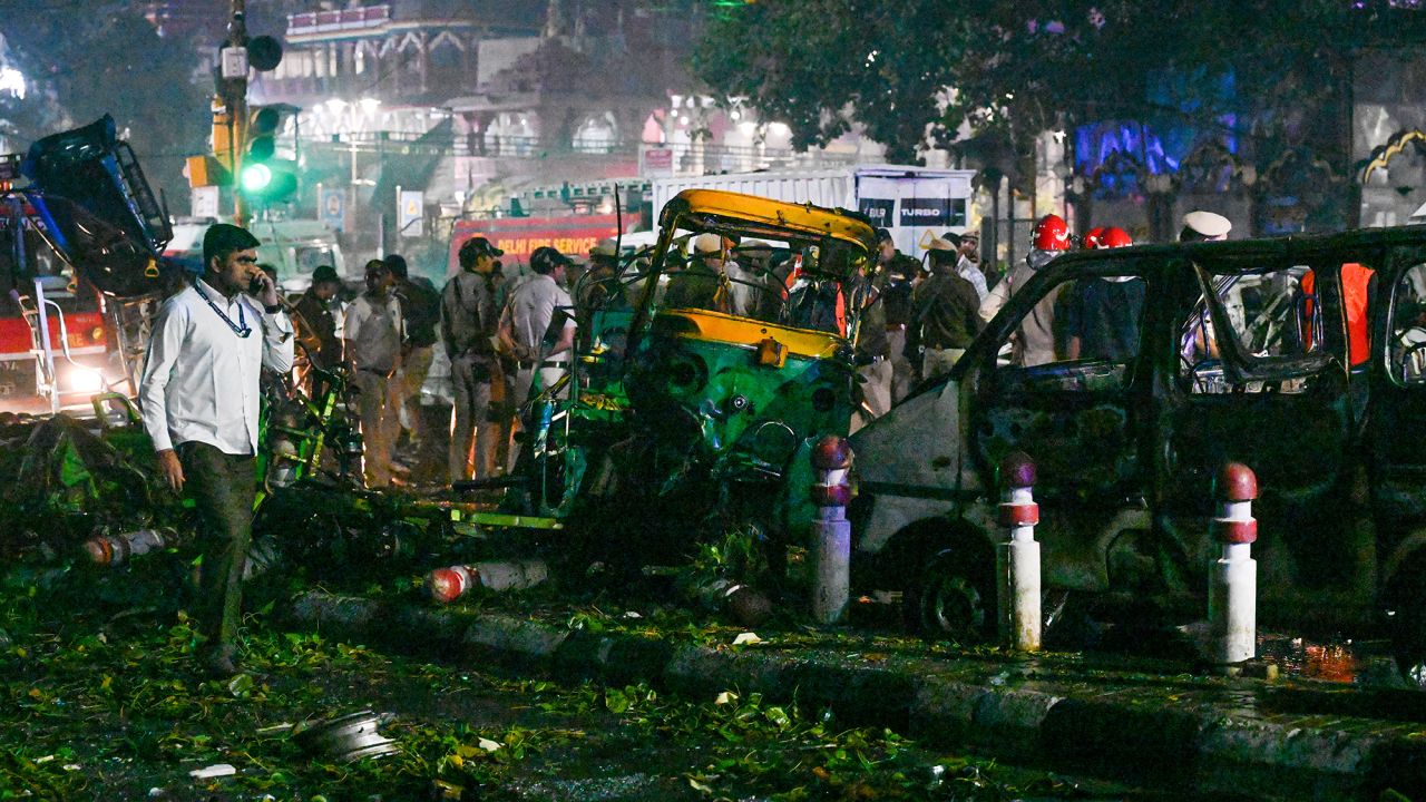 Teams from the National Security Guard, National Investigation Agency, forensic department and Delhi team investigate the site of a blast near the Red Fort Metro Station Gate No. 1 on November 10, 2025, in Delhi, India.