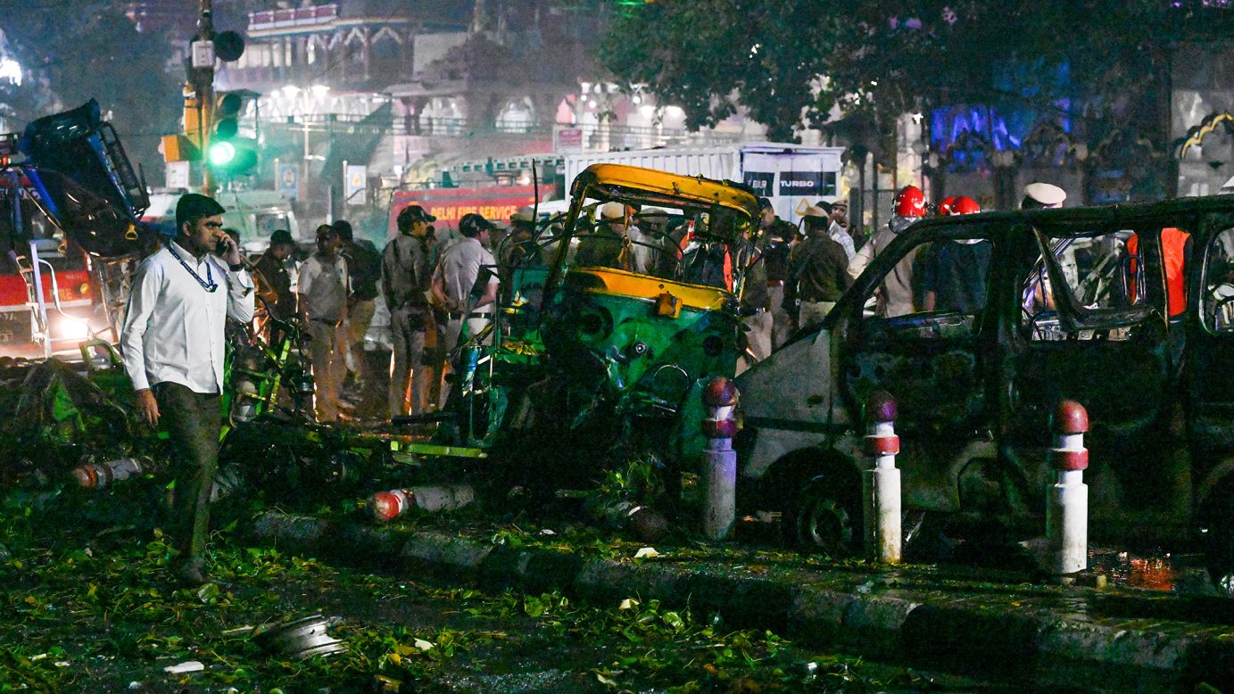 Teams from the National Security Guard, National Investigation Agency, forensic department and Delhi team investigate the site of a blast near the Red Fort Metro Station Gate No. 1 on November 10, 2025, in Delhi, India.