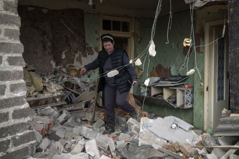Residents inspect the damage after a Russian drone attack in Kramatorsk, Ukraine, on November 11, 2025.
