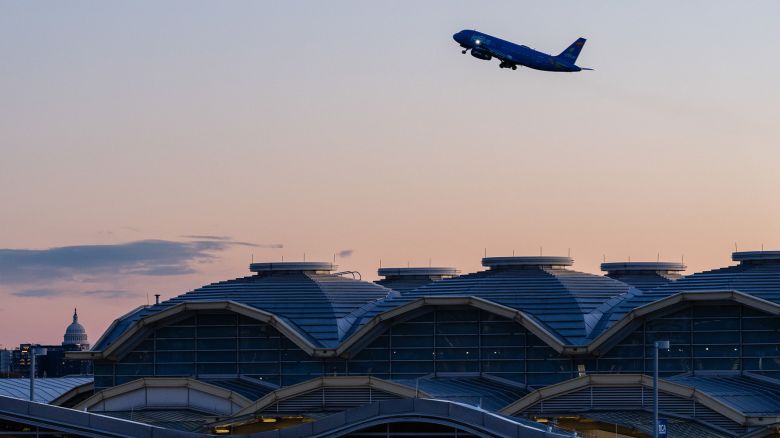 A JetBlue plane takes off from Ronald Reagan Washington National Airport (DCA) in Arlington, Virginia, US, on Tuesday, Nov. 11, 2025. The havoc plaguing the US travel industry will likely escalate Tuesday when tighter federal restrictions on flights take effect, even while lawmakers move closer toward ending the government shutdown. Photographer: Eric Lee/Bloomberg via Getty Images