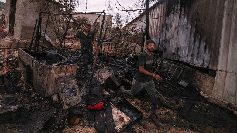 Palestinians inspect parts of a burnt house after an Israeli settlers attack in the village of Beit Lid, east of Tulkarm in the occupied West Bank on November 11, 2025. Violence in the West Bank has soared since the war in Gaza broke out in October 2023. (Photo by JAAFAR ASHTIYEH / AFP) (Photo by JAAFAR ASHTIYEH/AFP via Getty Images)          