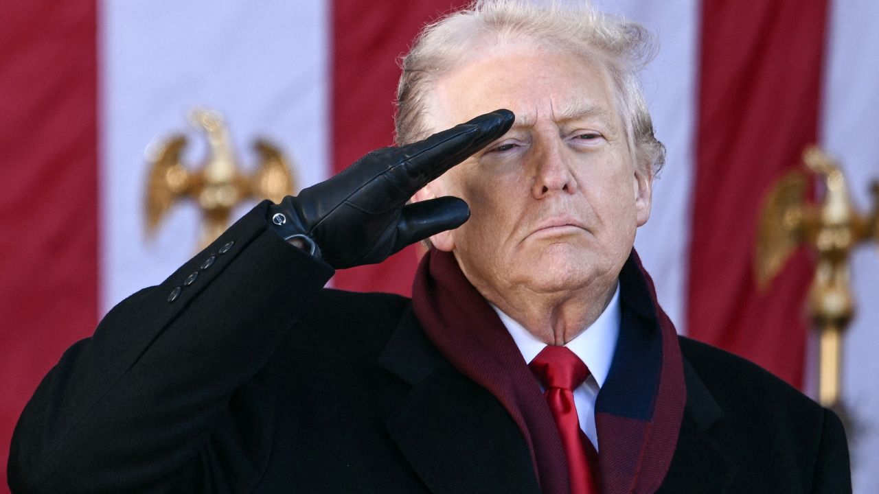 US President Donald Trump salutes at the conclusion of a Veterans Day ceremony at Arlington National Cemetery in Arlington, Virginia on November 11, 2025. (Photo by Brendan SMIALOWSKI / AFP) (Photo by BRENDAN SMIALOWSKI/AFP via Getty Images)