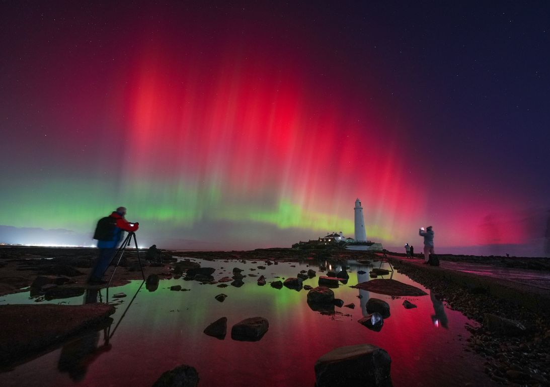 The aurora borealis danced in the skies over St. Mary's Lighthouse in Whitley Bay on the northeast coast of England on Wednesday.