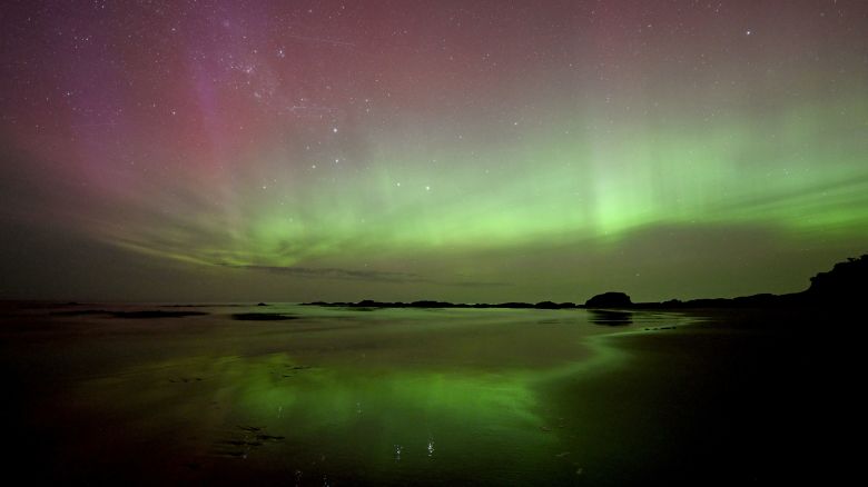 The aurora australis, also known as the southern lights, glowed over the waters of Brighton Beach in Dunedin, New Zealand, on November 13.
