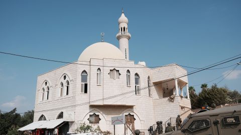 SALFIT, WEST BANK - NOVEMBER 13: Israeli forces surround the area around the al-Hajj Hamid Mosque, which had been set on fire by settler Israelis in the city of Selfit in the West Bank on November 13, 2025. (Photo by Issam Rimawi/Anadolu via Getty Images)
