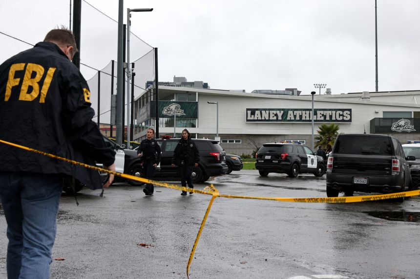 Officers investigate after a shooting at Laney College in Oakland, California, on Thursday.