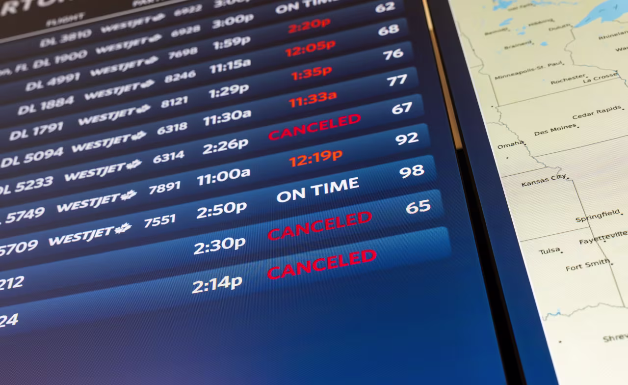 A board shows flight delays and cancellations at New York's LaGuardia Airport on Monday.