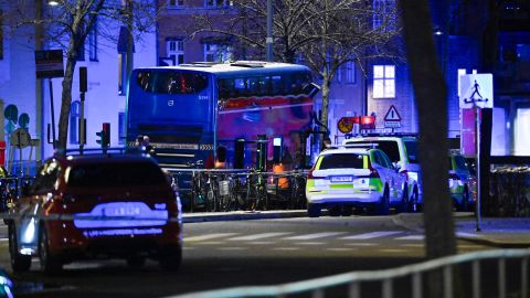 First responders working at the scene where a bus crashed in to people in Stockholm, Sweden.