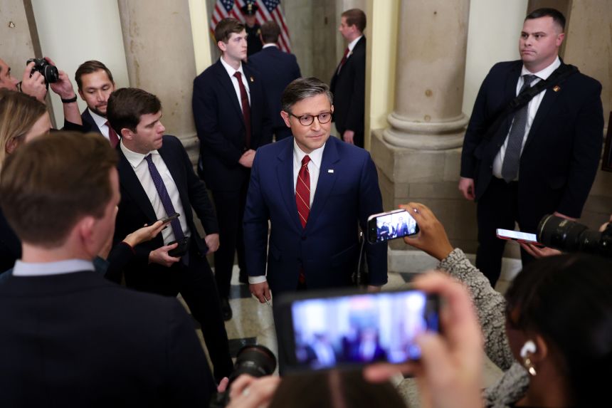 Speaker of the House Mike Johnson (R-LA) (C) speaks to members of the media outside his office at the US Capitol on Wednesday, in Washington, DC.