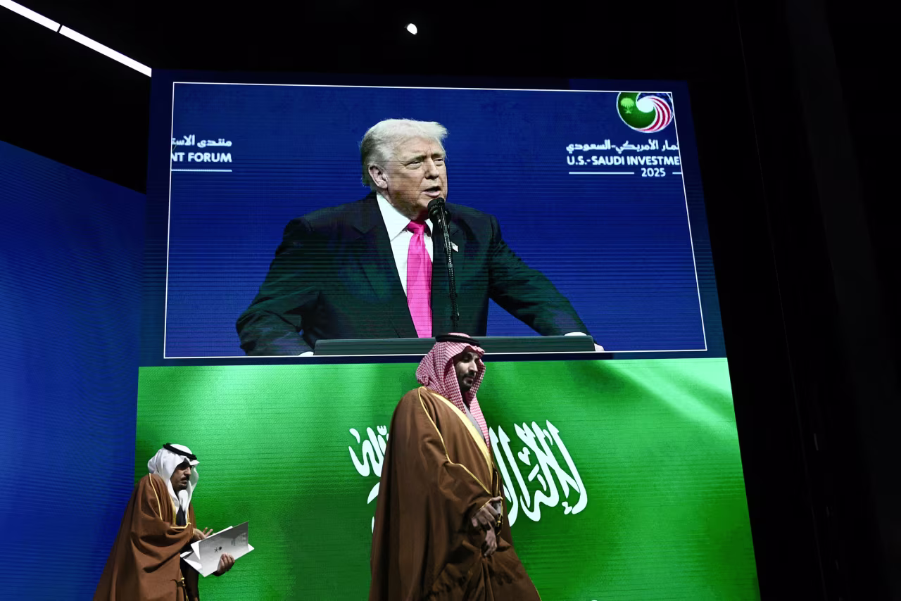 Crown Prince of the Kingdom of Saudi Arabia Mohammed bin Salman, right, arrives as President Donald Trump is seen on a screen delivering remarks at the US-Saudi Investment Forum at the John F. Kennedy Center for the Performing Arts in Washington, DC on Wednesday.